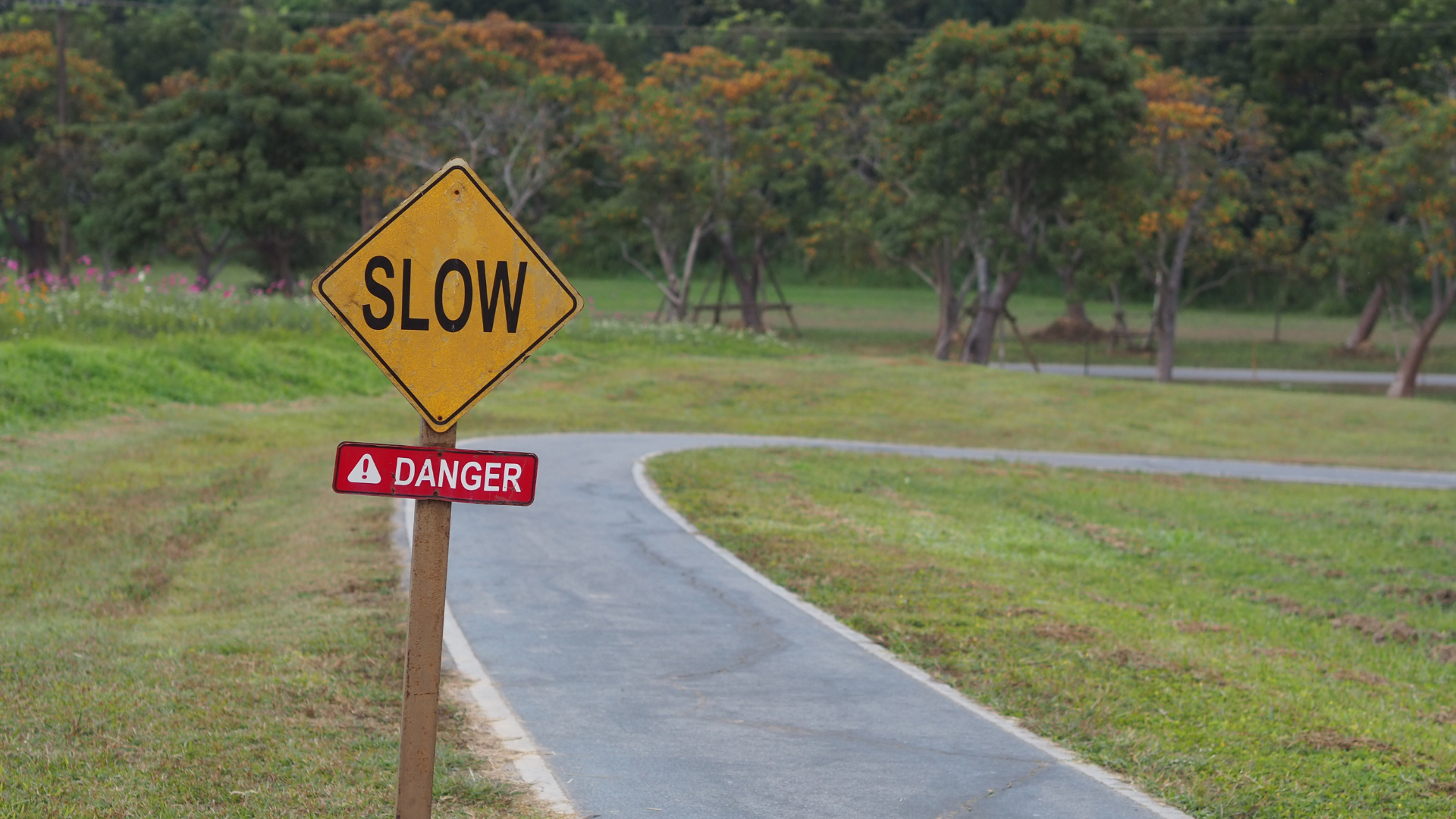 Slow warning sign representing construction delays and risks in underground utility projects and job site timelines